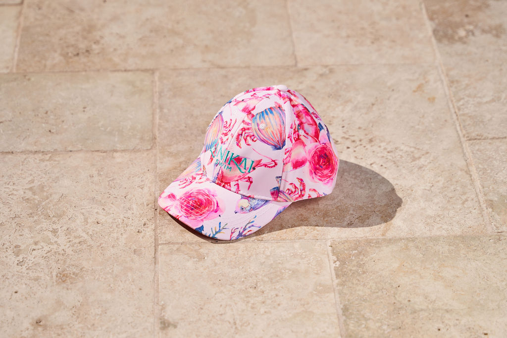 Floral-patterned cap on a stone pavement